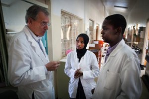 A. Leland Albright, MD, meets with Deeqa Kumar, a visiting medical officer from Somalia, and Humphrey Okechi, MBChB, a neurosurgical colleague who assisted Dr. Albright in completing a number of surgeries during his time in Kijabe, Kenya.